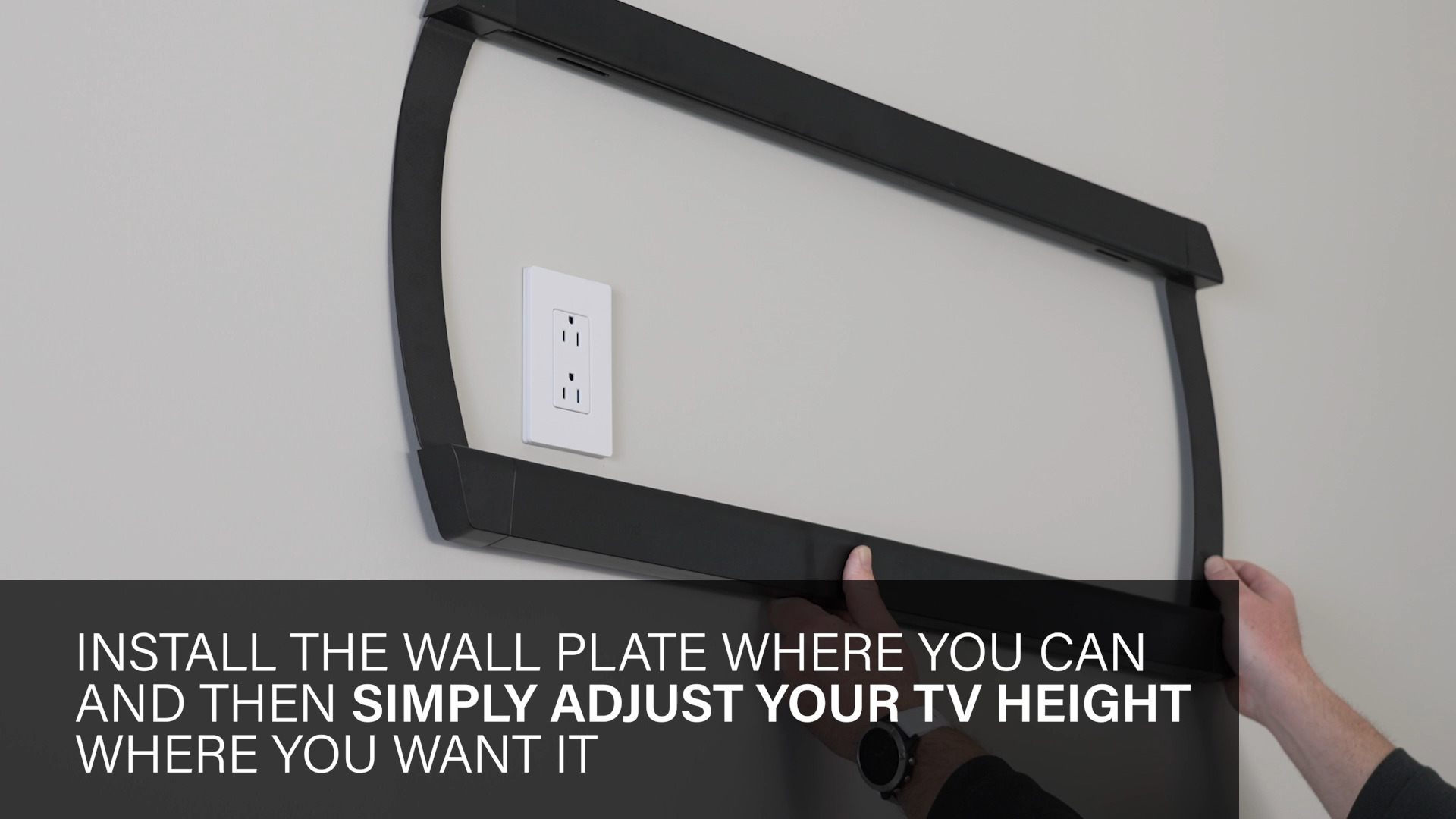 Mount being held up around an outlet to show placement